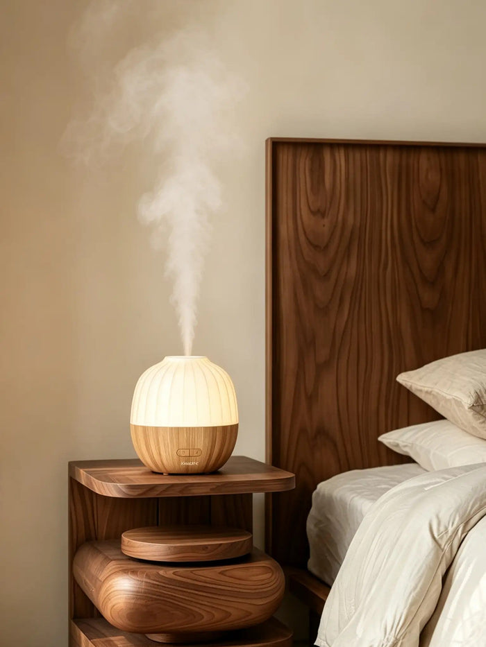 Acorn aroma diffuser glowing softly on a bedroom nightstand