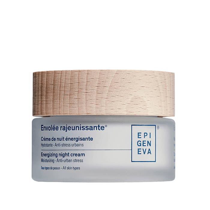 Energieva night cream jar with natural wooden cap on a green background