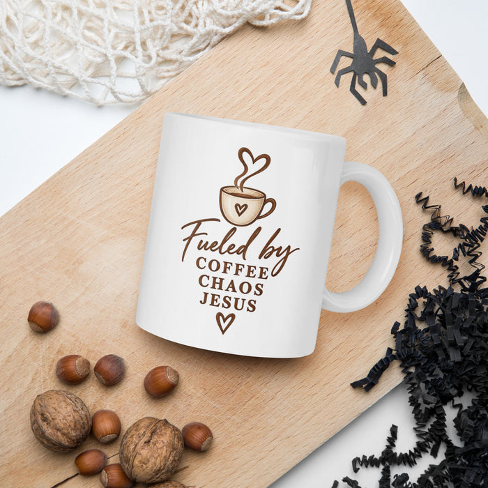 11 oz Fueled by Coffee, Chaos & Jesus mug in lifestyle setting