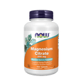 Bottle of NOW Magnesium Citrate supplement on a green background
