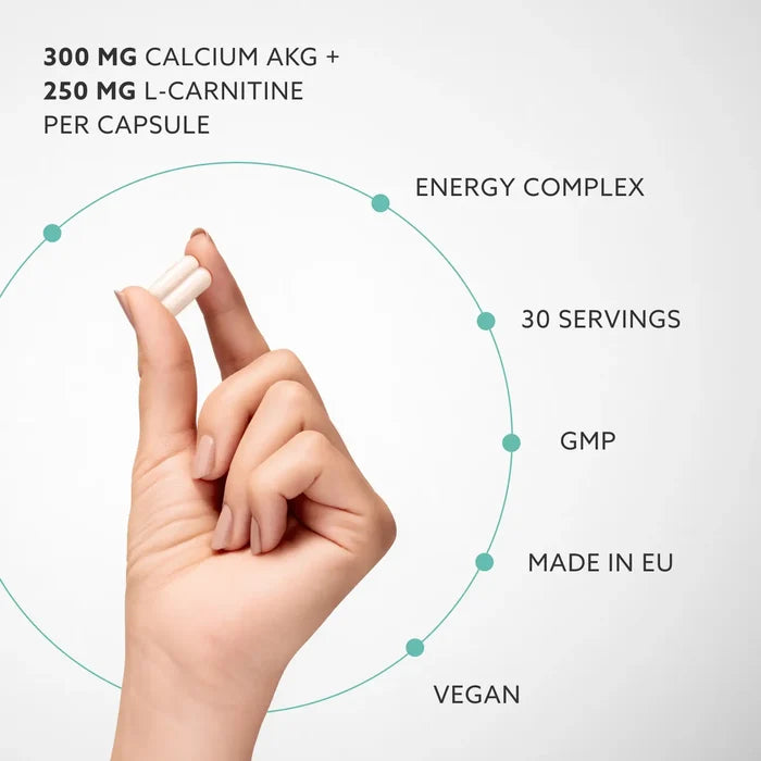 Hand holding a capsule with nutritional information text on a light gray background